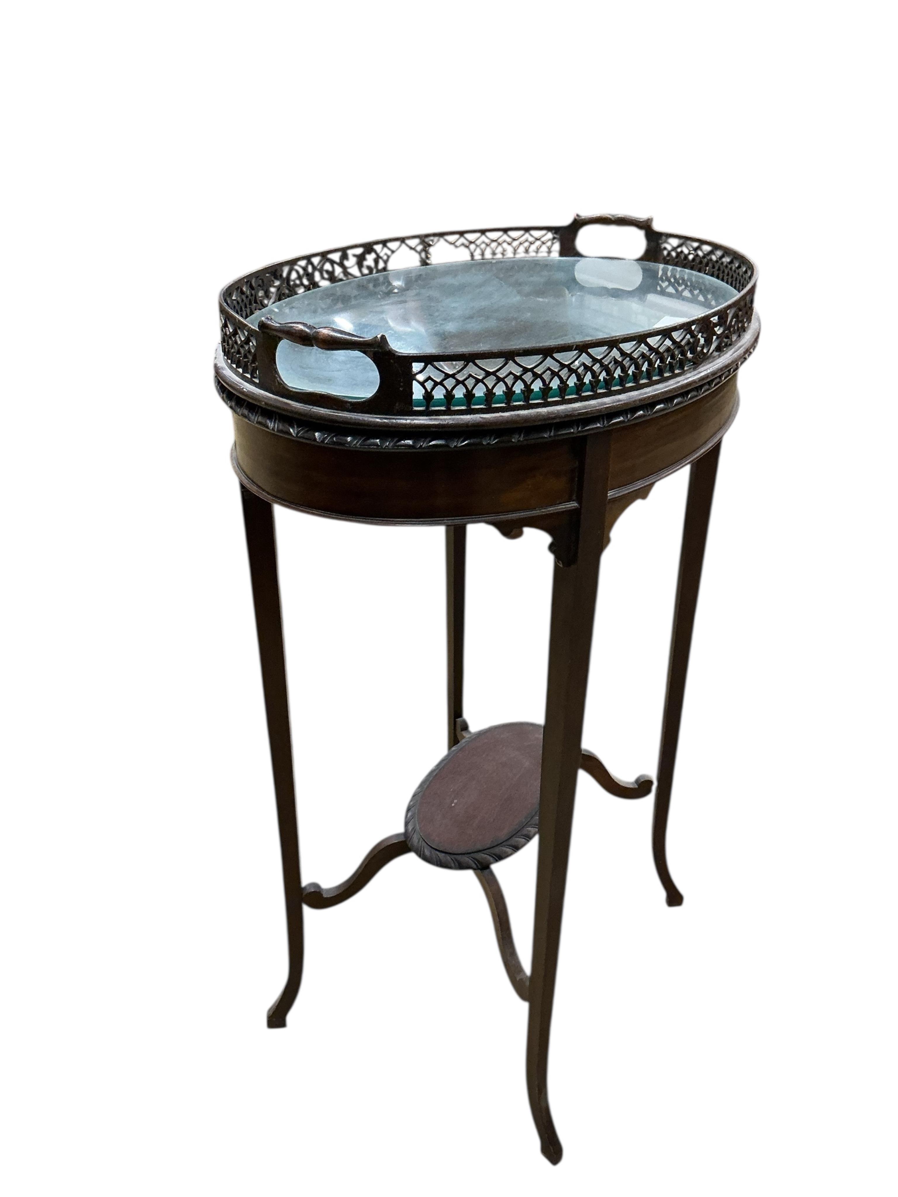 An Edwardian oval galleried tea tray on associated stand, width 59cm, depth 39cm, height 78cm